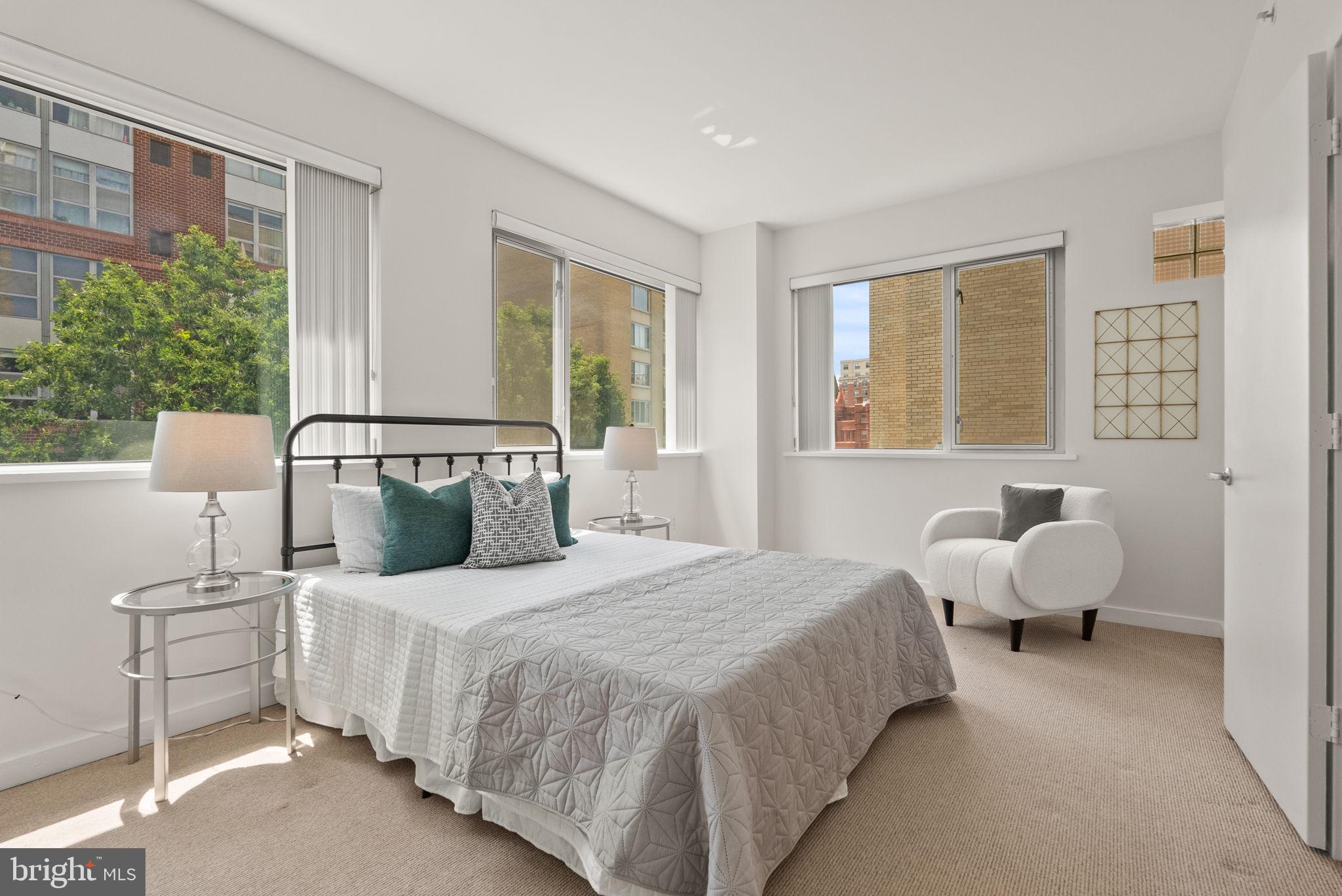 1300 13th Street Northwest, Unit 408 Washington, DC 20005 - Photo 32 of 47 a bedroom with bed and large window
