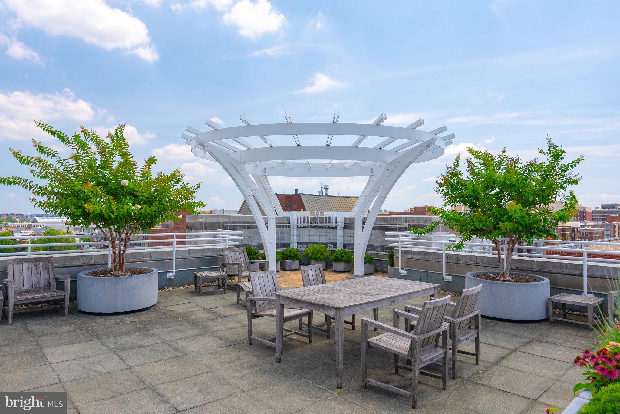1300 13th Street Northwest, Unit 408 Washington, DC 20005 - Photo 40 of 47 a patio with table and chairs