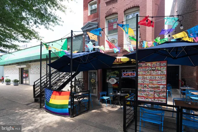 a bunch of flowers in a kitchen