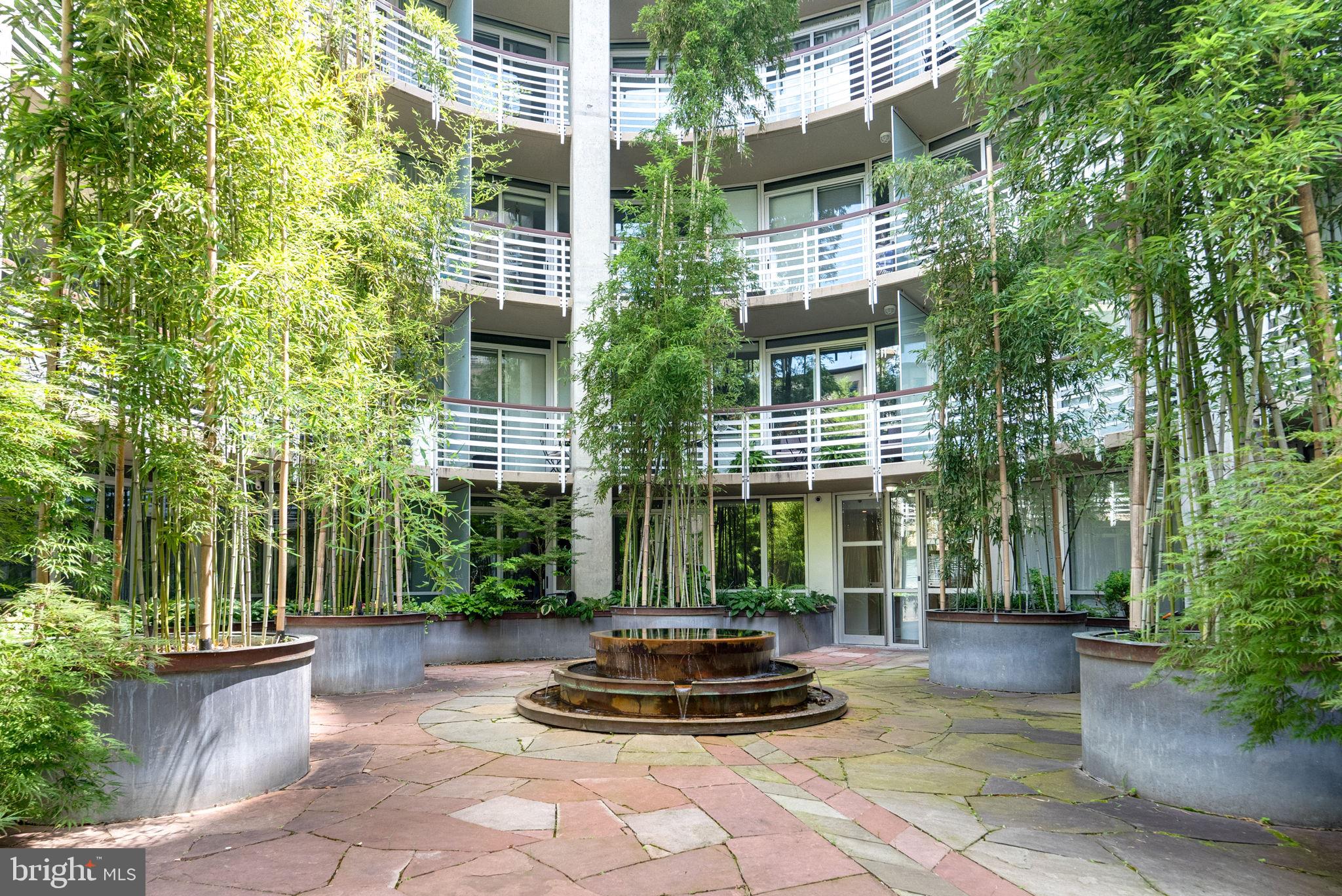 1300 13th Street Northwest, Unit 408 Washington, DC 20005 - Photo 6 of 47 a front view of a house with a yard