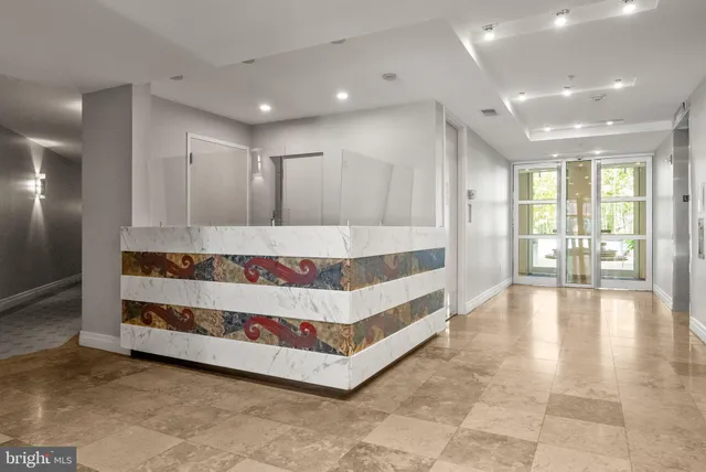 a bathroom with a tub and shower