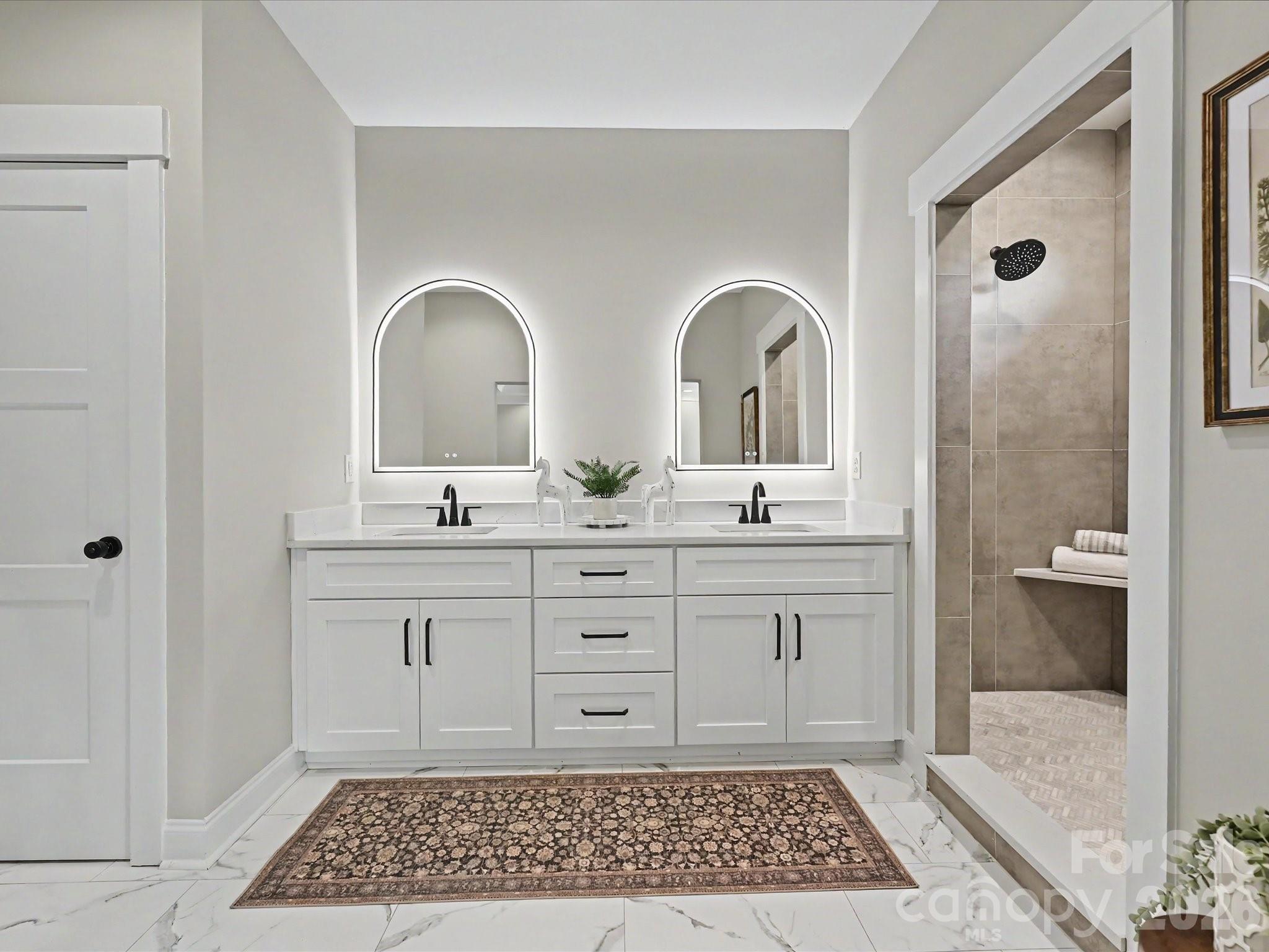 5310 West Liberty Hill Road York, SC 29745 - Photo 14 of 29 a bathroom with a double vanity sink and a mirror