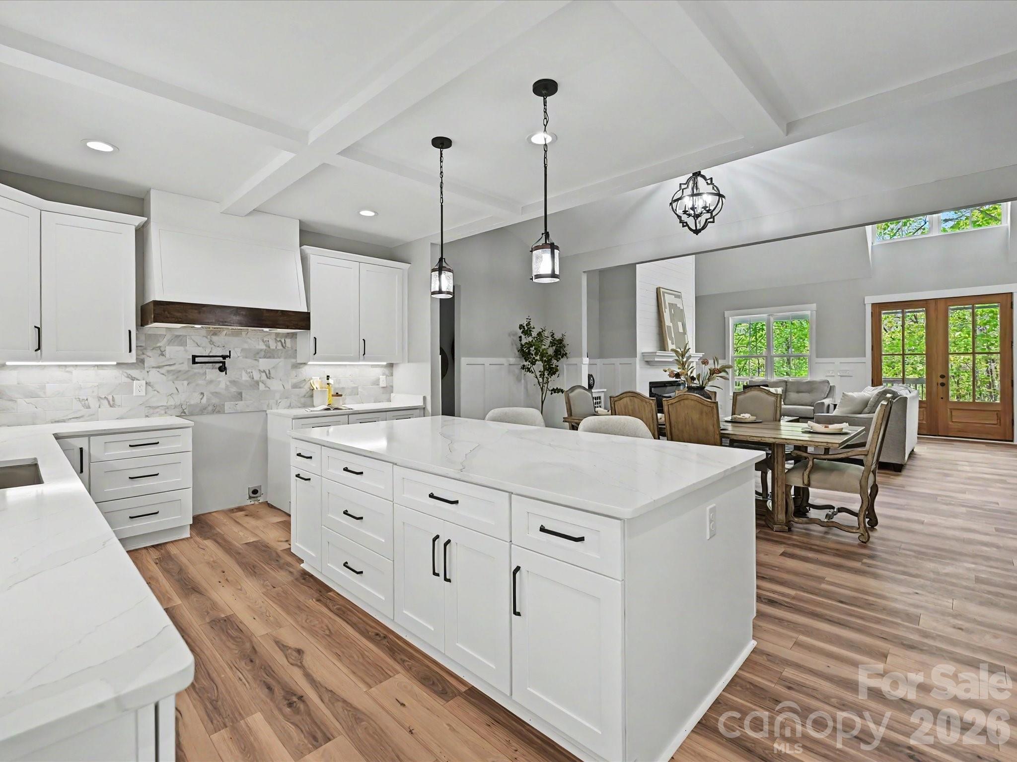 5310 West Liberty Hill Road York, SC 29745 - Photo 10 of 29 a large white kitchen with cabinets