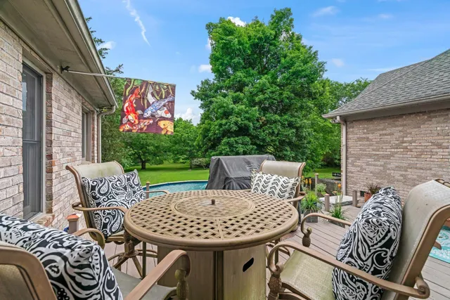a kitchen with granite countertop a sink cabinets and window