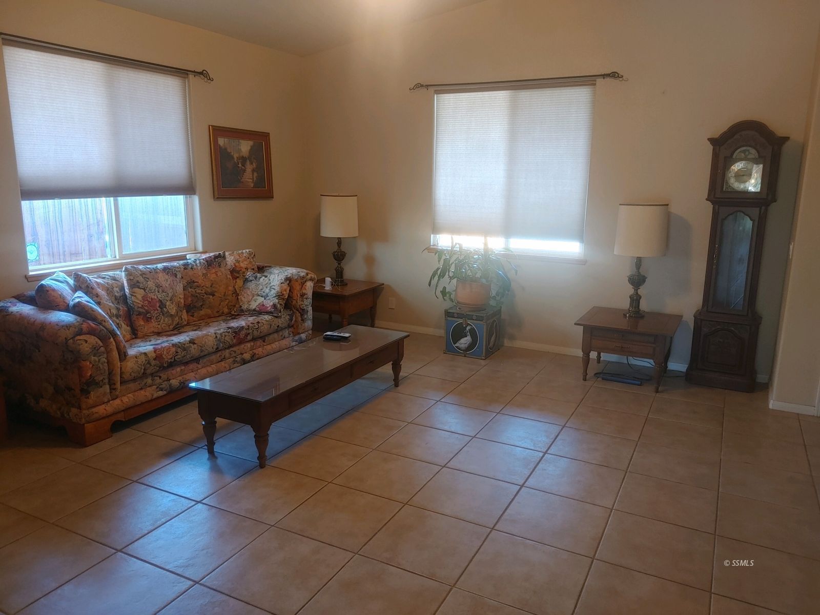 1145 West St George Avenue Ridgecrest, CA 93555 - Photo 4 of 16 a living room with furniture a lamp and a window