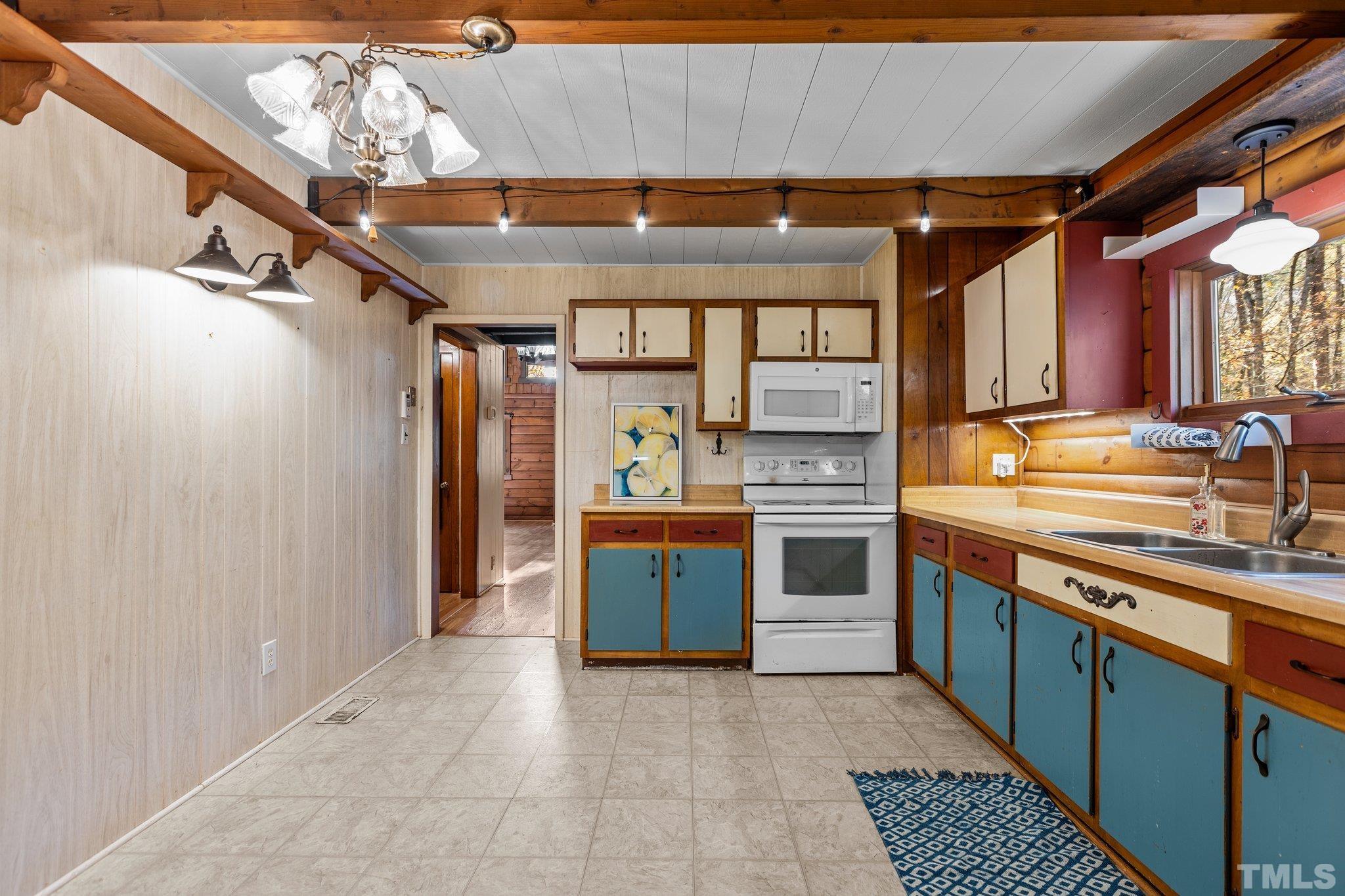 300 Rabbit Run Pittsboro, NC 27312 - Photo 11 of 38 a kitchen with stainless steel appliances kitchen island granite countertop a stove and a sink