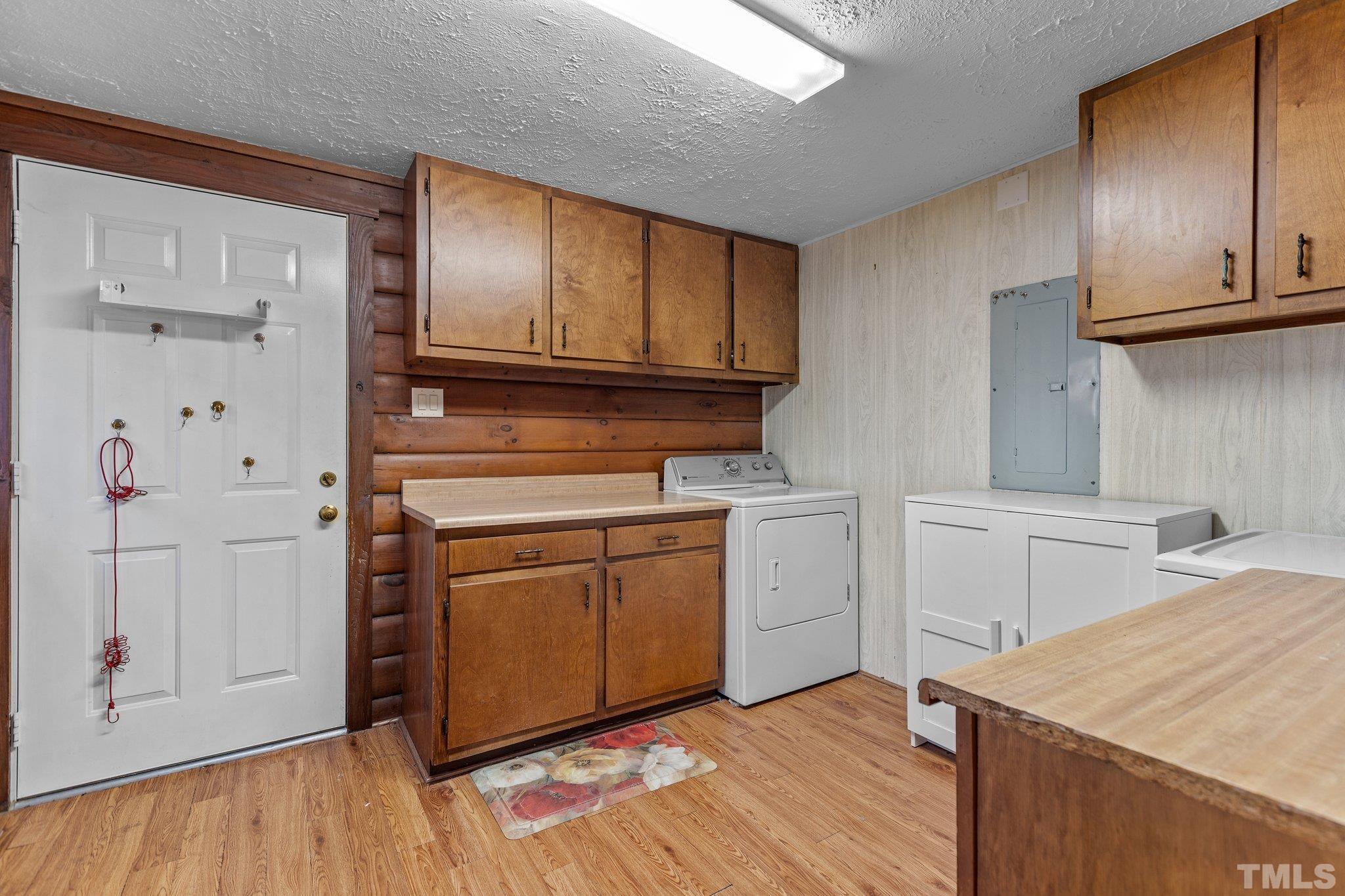 300 Rabbit Run Pittsboro, NC 27312 - Photo 14 of 38 a kitchen with a sink cabinets and wooden floor