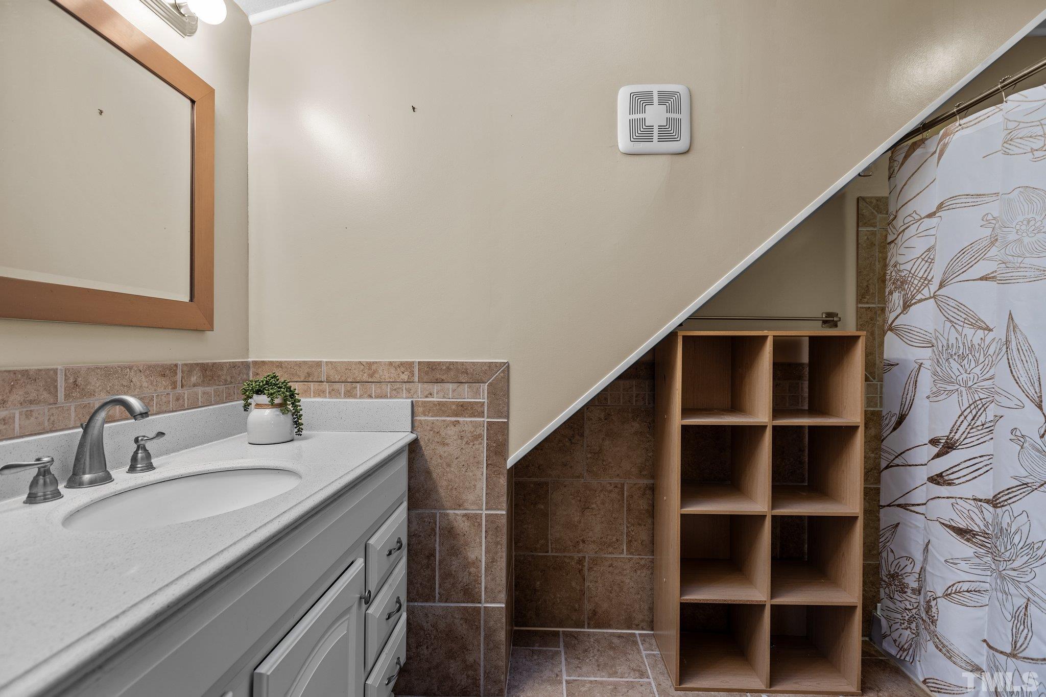300 Rabbit Run Pittsboro, NC 27312 - Photo 18 of 38 a bathroom with a sink and a mirror