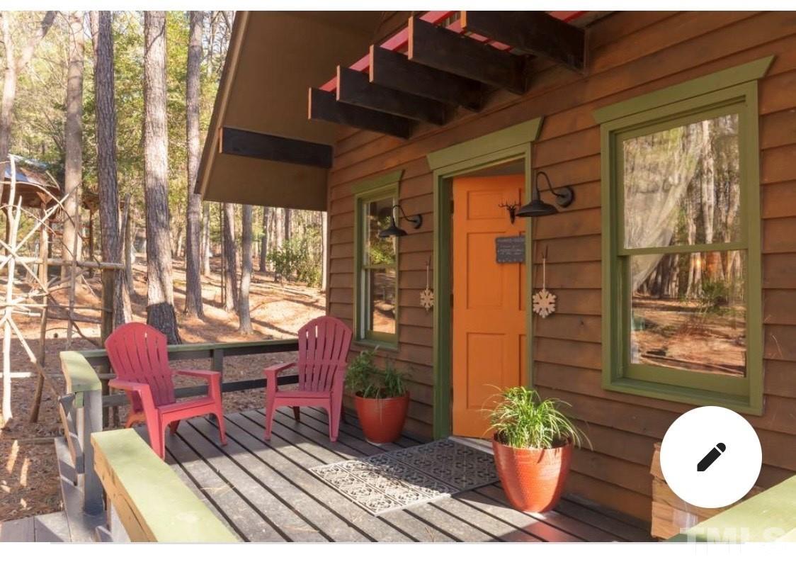 300 Rabbit Run Pittsboro, NC 27312 - Photo 20 of 38 a dining room with furniture and wooden floor