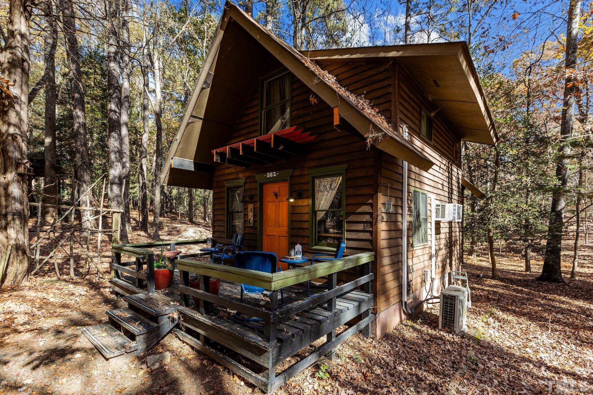 300 Rabbit Run Pittsboro, NC 27312 - Photo 24 of 38 a view of a two chair and table of the back yard