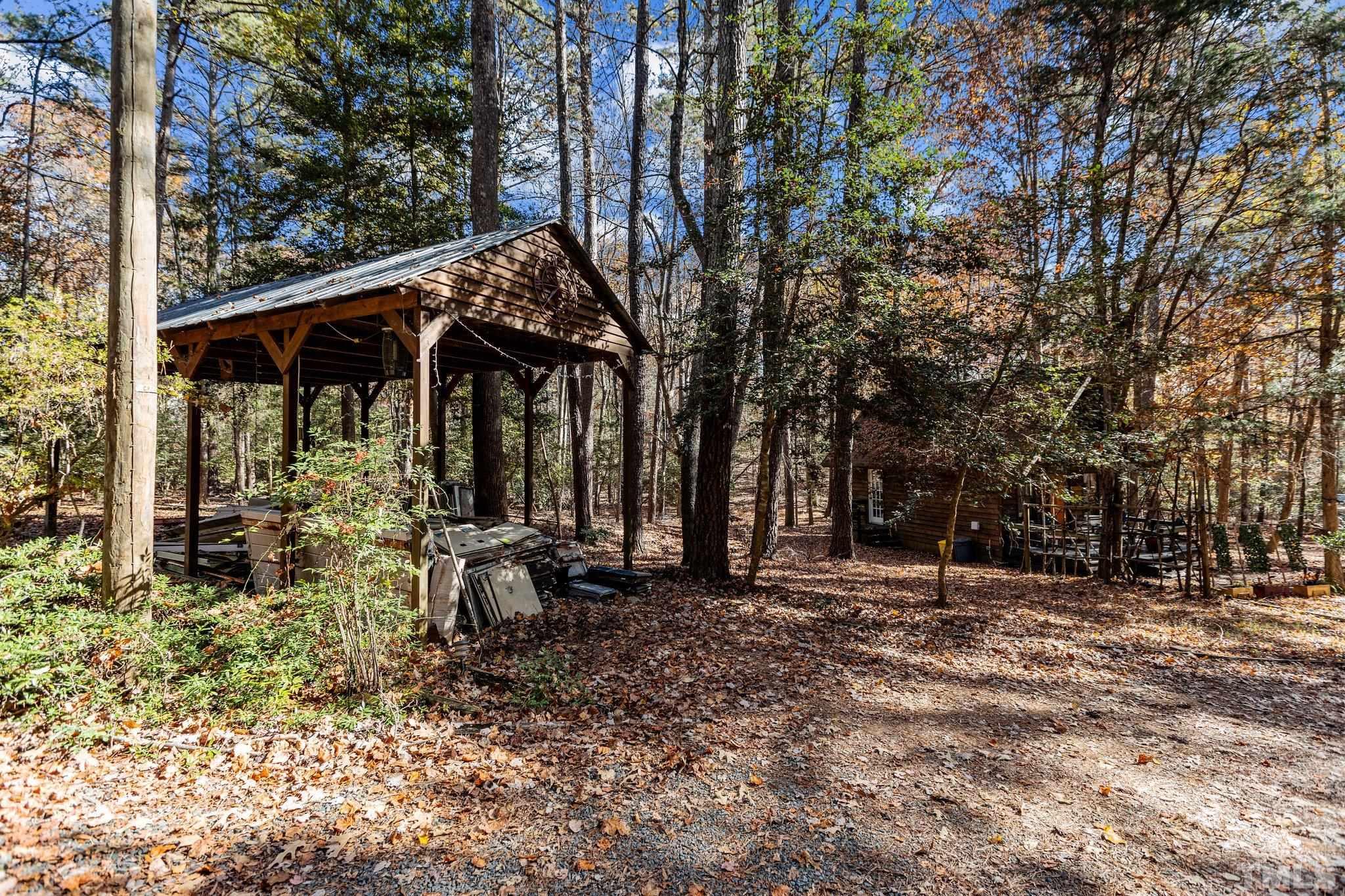 300 Rabbit Run Pittsboro, NC 27312 - Photo 36 of 38 a backyard of a house with barbeque oven
