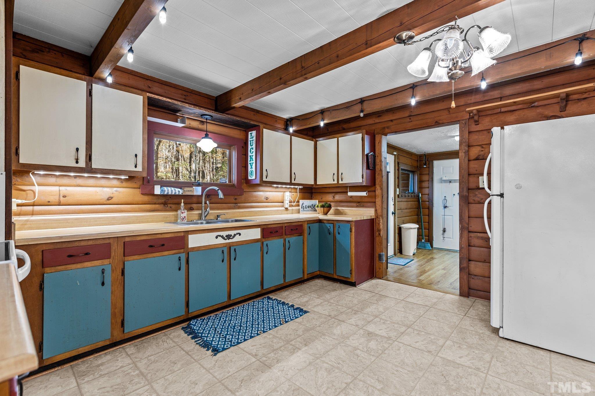 300 Rabbit Run Pittsboro, NC 27312 - Photo 10 of 38 a kitchen with stainless steel appliances granite countertop a refrigerator and a sink