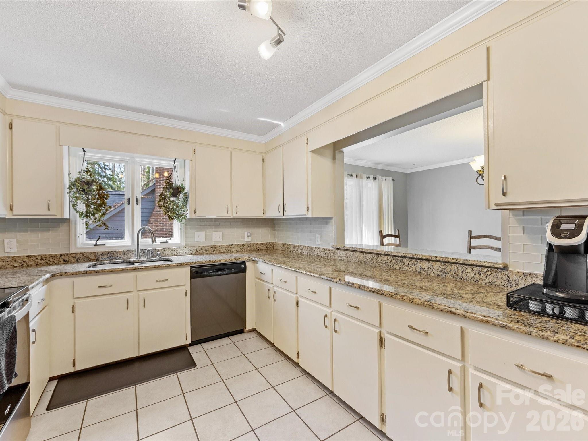 3489 Lake Shore Road South Denver, NC 28037 - Photo 12 of 31 a kitchen with granite countertop sink window and white stainless steel appliances