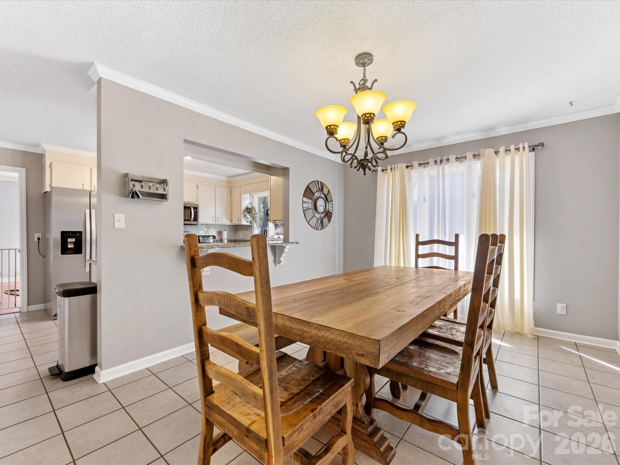 3489 Lake Shore Road South Denver, NC 28037 - Photo 14 of 31 a view of a dining room with furniture and chandelier