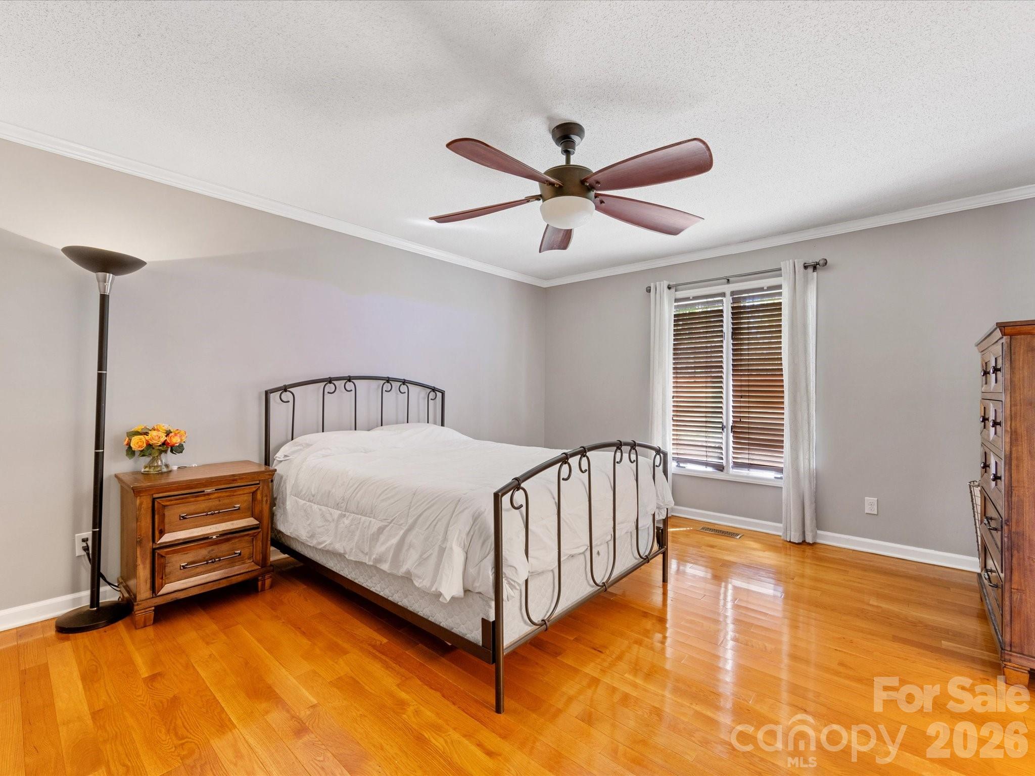 3489 Lake Shore Road South Denver, NC 28037 - Photo 16 of 31 a spacious bedroom with a bed and a table in it