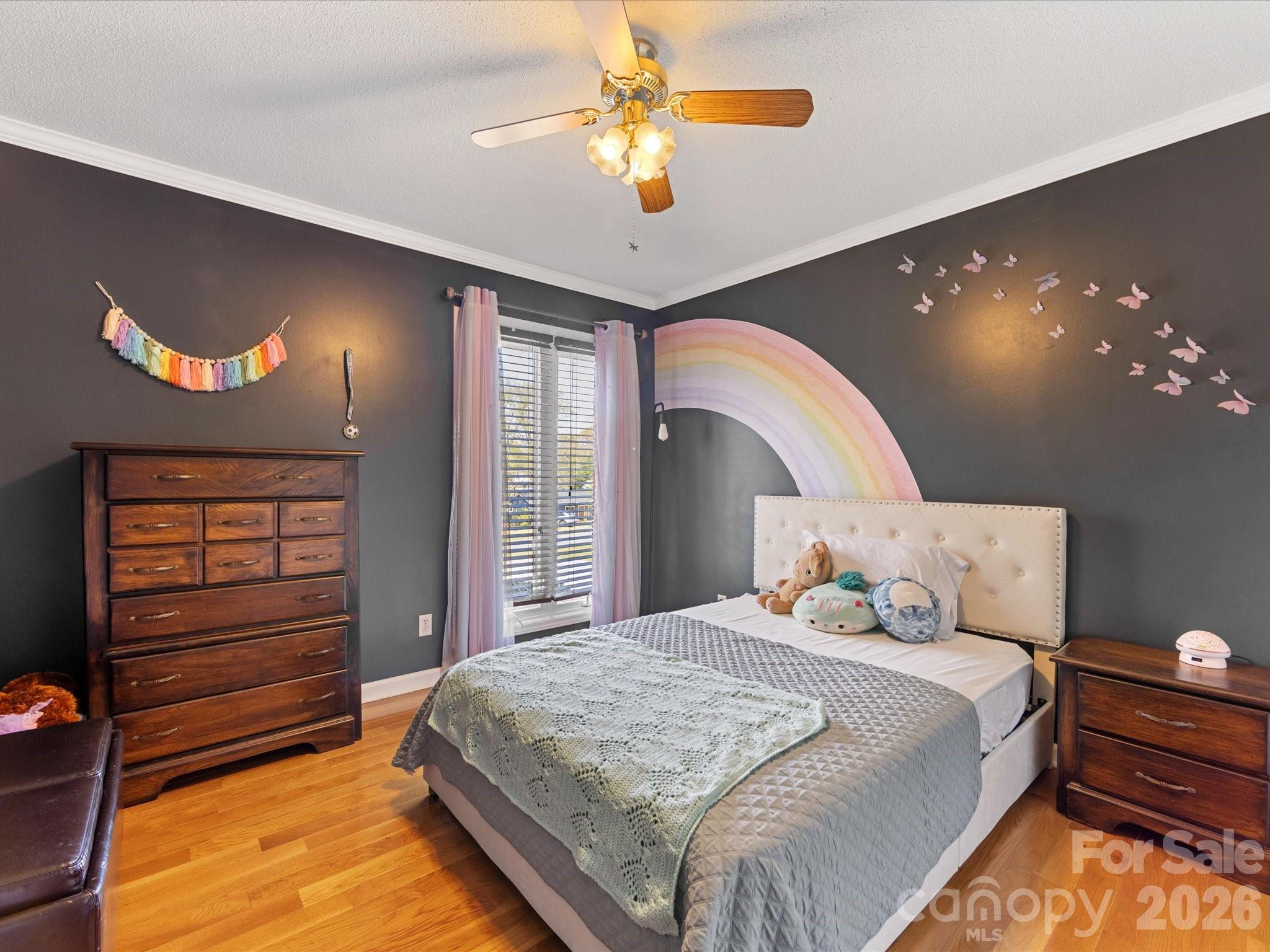 3489 Lake Shore Road South Denver, NC 28037 - Photo 19 of 31 a bedroom with a bed and a chandelier