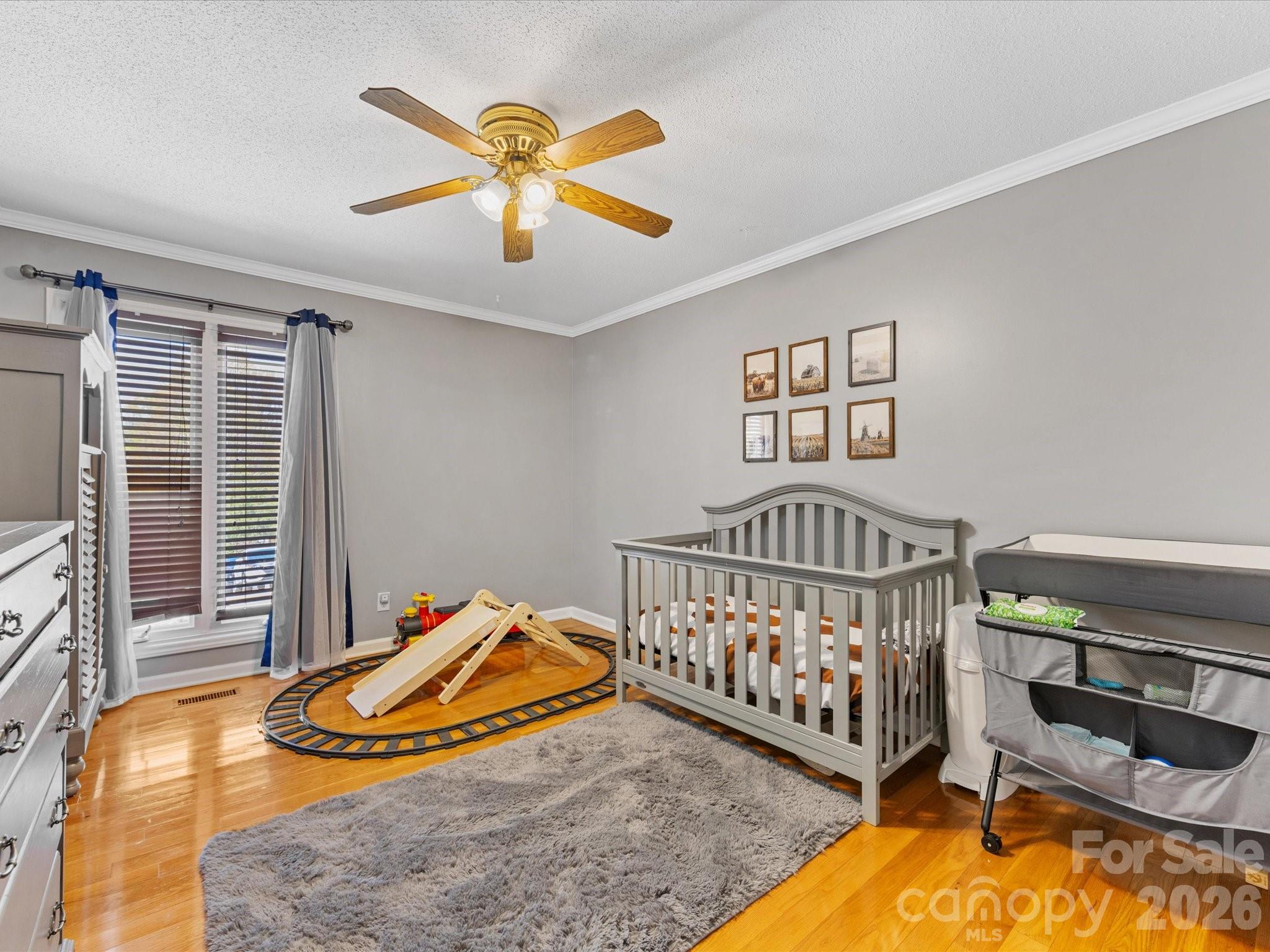 3489 Lake Shore Road South Denver, NC 28037 - Photo 22 of 31 a view of a bedroom with wooden floor