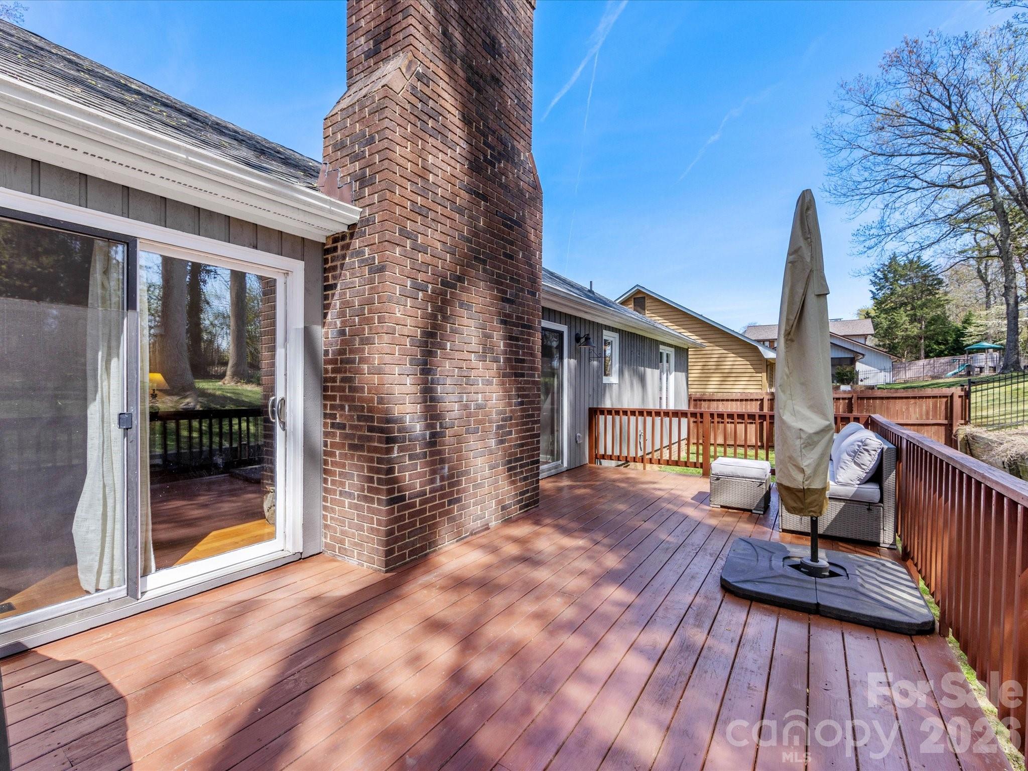 3489 Lake Shore Road South Denver, NC 28037 - Photo 24 of 31 a view of backyard with a deck and wooden floor