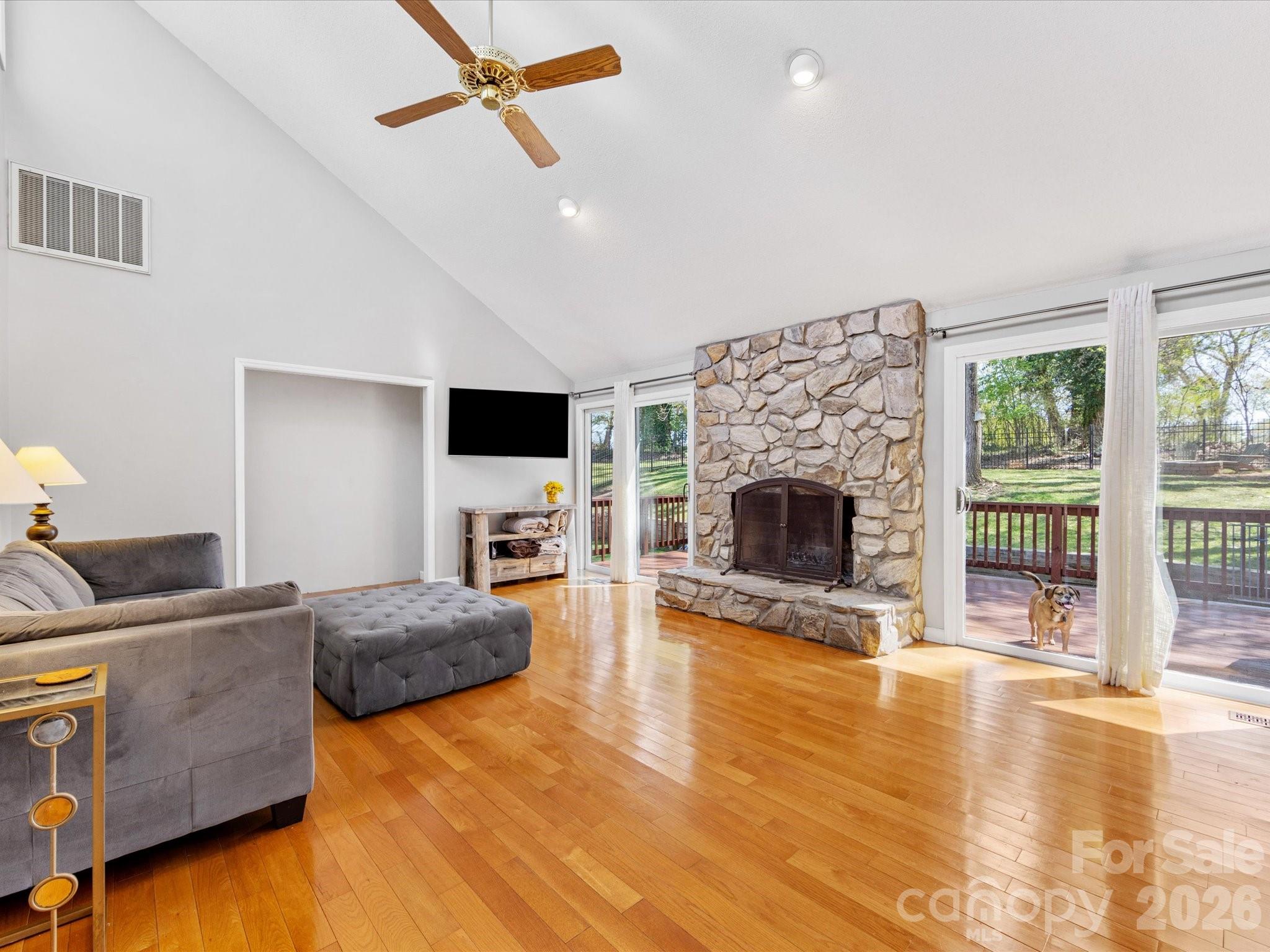 3489 Lake Shore Road South Denver, NC 28037 - Photo 6 of 31 a living room with furniture and a fireplace