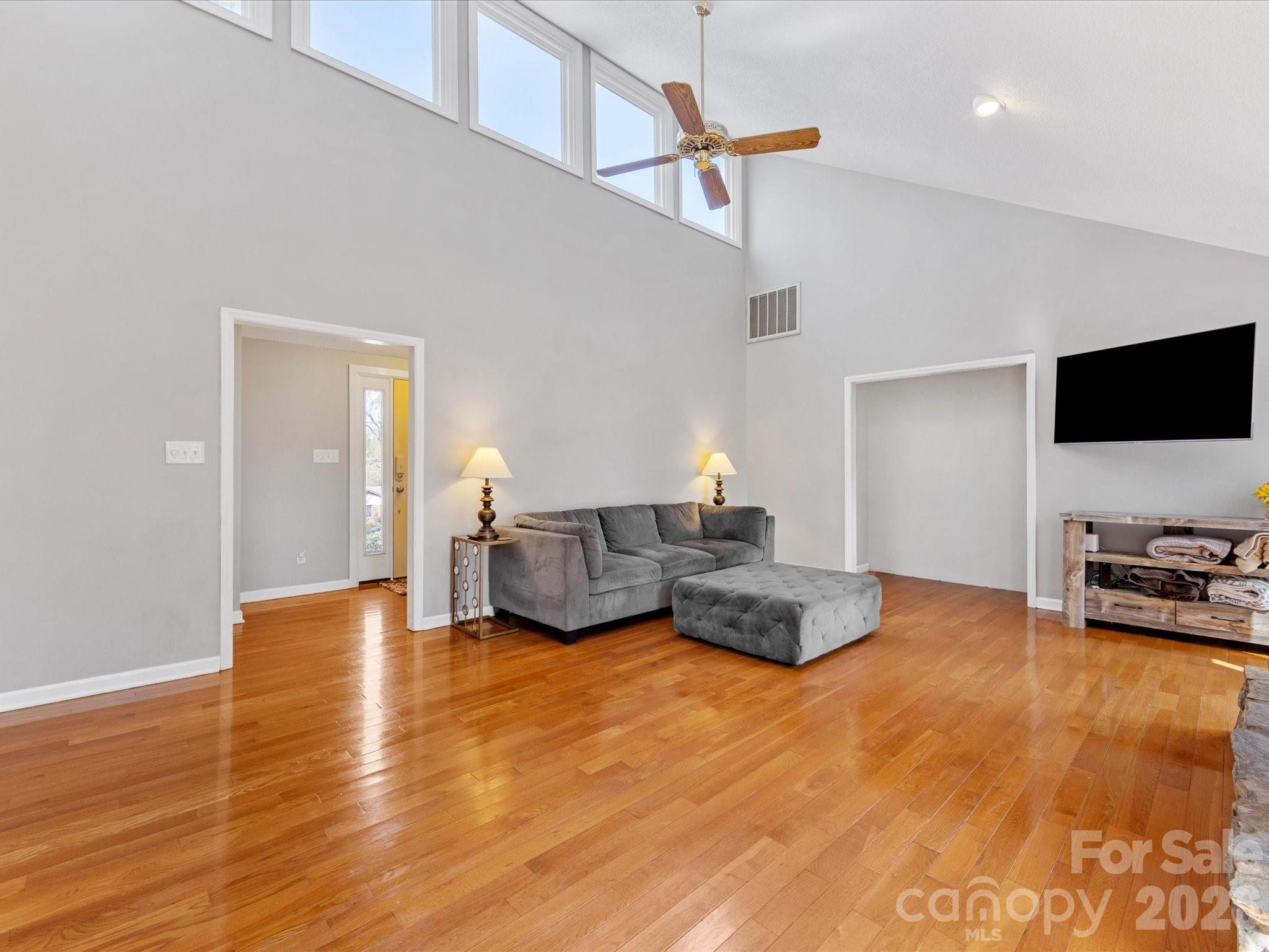 3489 Lake Shore Road South Denver, NC 28037 - Photo 8 of 31 a living room with furniture and a flat screen tv