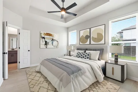 a bedroom with a bed and a painting on the wall