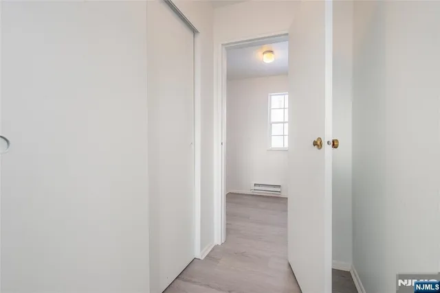 a view of a bathroom from a hallway