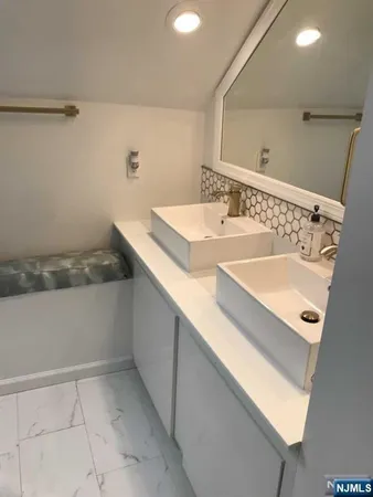 a bathroom with a sink and a bathtub