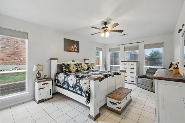 a bed room with a bed and a window