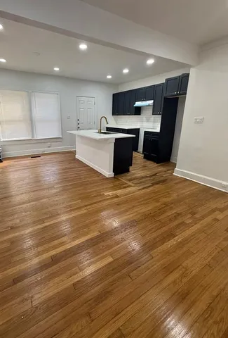 a view of kitchen with wooden floor