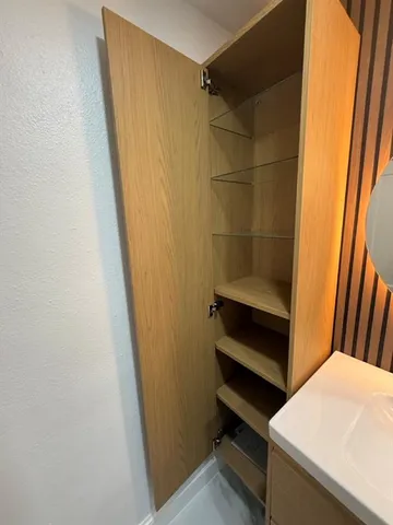 a bathroom with a sink and washing machine