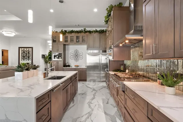 a kitchen with counter top space cabinets and stainless steel appliances
