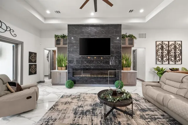 a living room with furniture and a fireplace