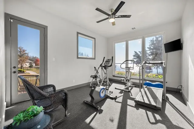 a view of a livingroom with workspace and a couch