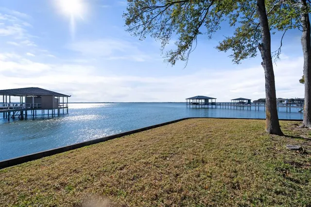 a view of a swimming pool and an outdoor seating