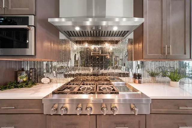 a kitchen with a stove and cabinets