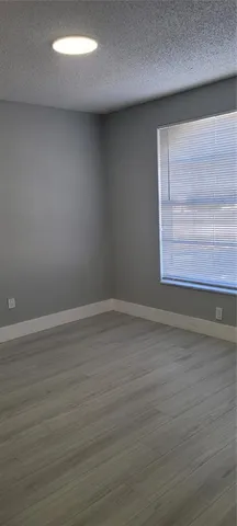 a white toilet sitting next to a white sink