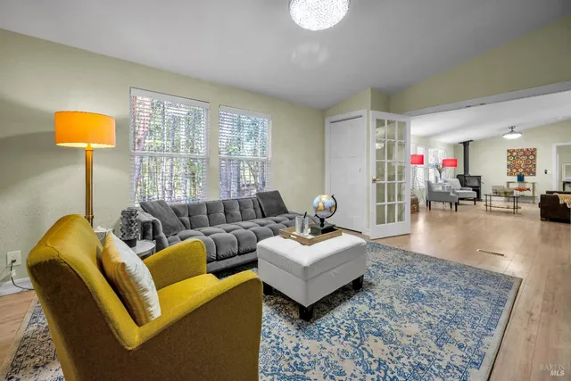 a view of a livingroom with furniture and a ceiling fan