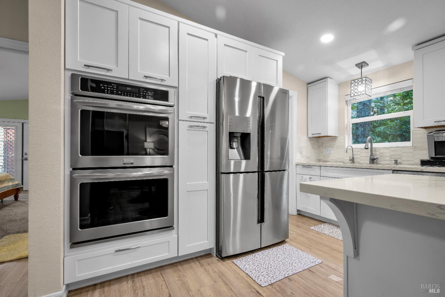 22945 Ridge Road Willits, CA 95490 - Photo 17 of 48 a kitchen with stainless steel appliances a refrigerator sink and cabinets