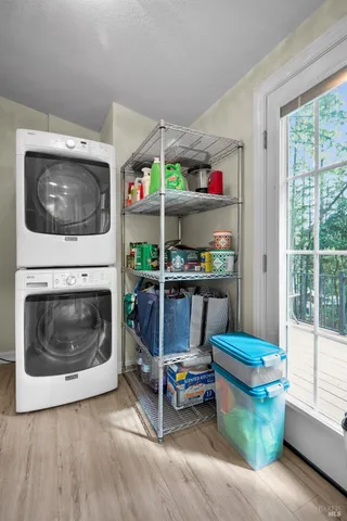 a bedroom with a bed dresser and a window