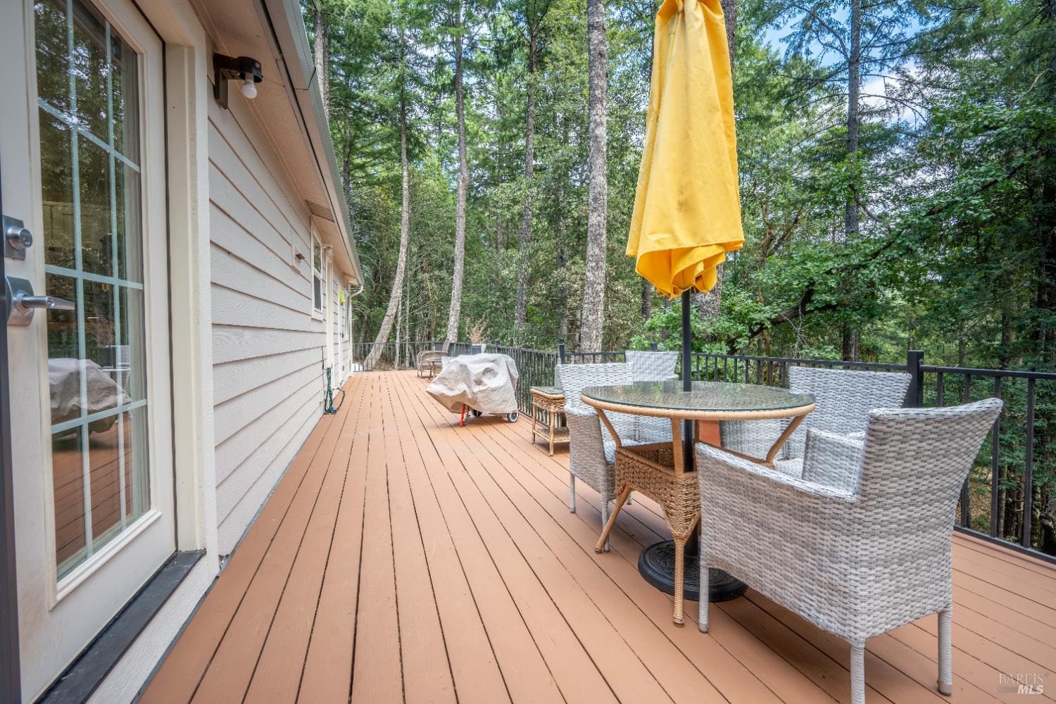 22945 Ridge Road Willits, CA 95490 - Photo 24 of 48 a view of a patio with a table and chairs