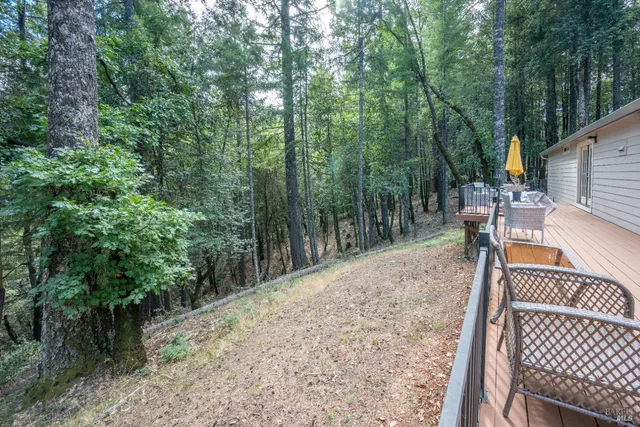 a view of a wooden deck with a bench