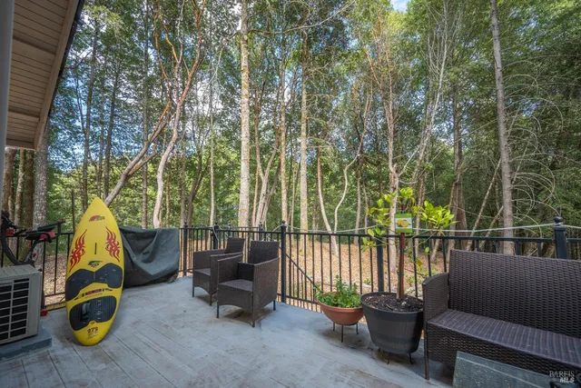 a view of a yard with trees in the background