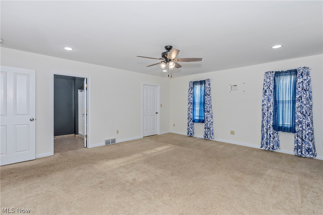 917 Brunswick Road Cleveland Heights, OH 44112 - Photo 18 of 42 Stunning primary suite with recessed lighting, ceiling fan, two walkin closets and full bat.