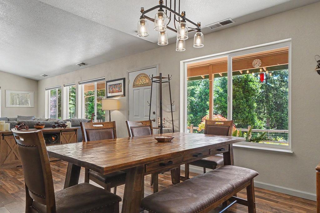 26845 Spring Court Pioneer, CA 95666 - Photo 11 of 89 a view of a dining room with furniture window and outside view