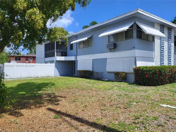 a house view with a garden space