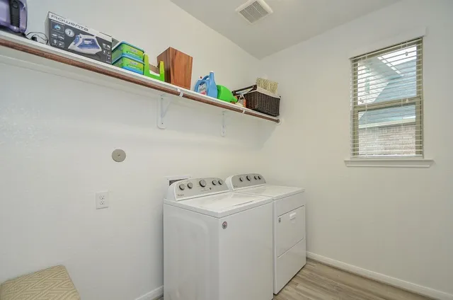 a utility room with dryer and washer