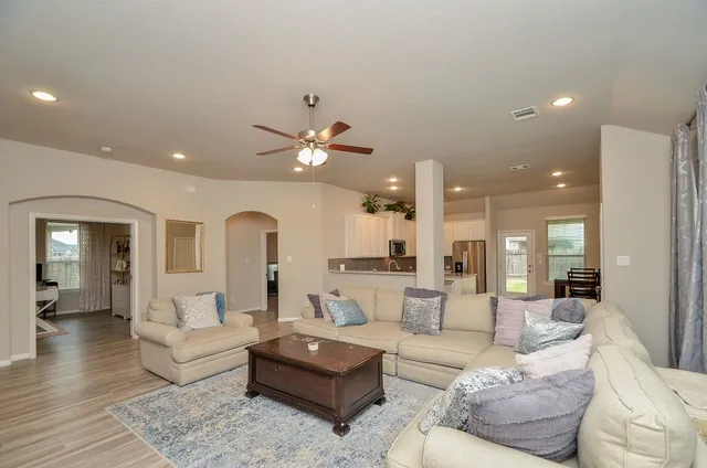 a living room with furniture and a view of living room