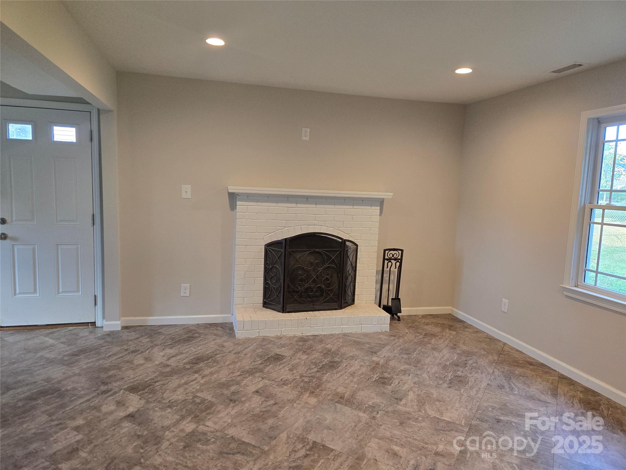 7214 Fox Hunt Road Charlotte, NC 28212 - Photo 19 of 24 an empty room with windows