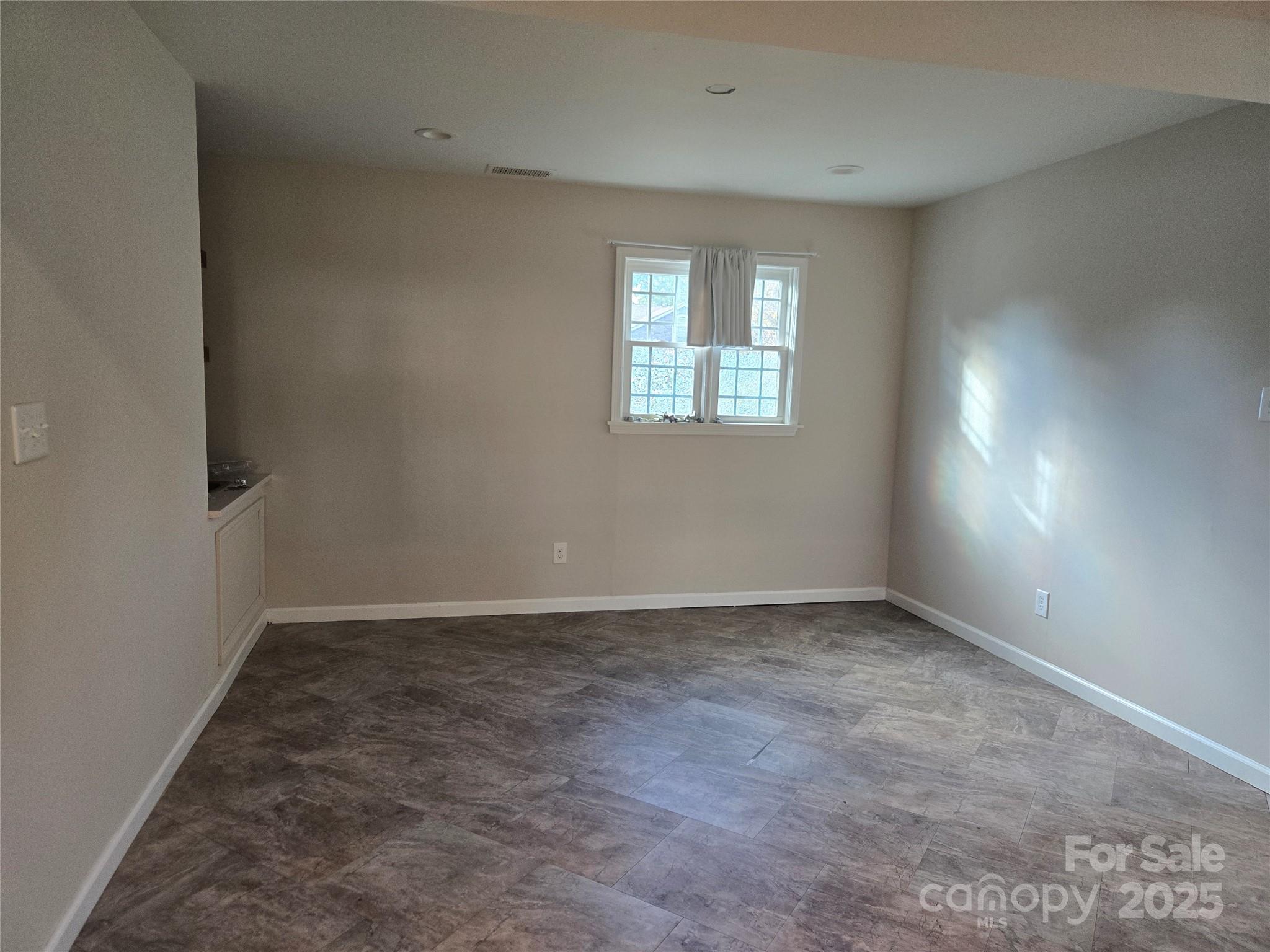 7214 Fox Hunt Road Charlotte, NC 28212 - Photo 20 of 24 an empty room with windows