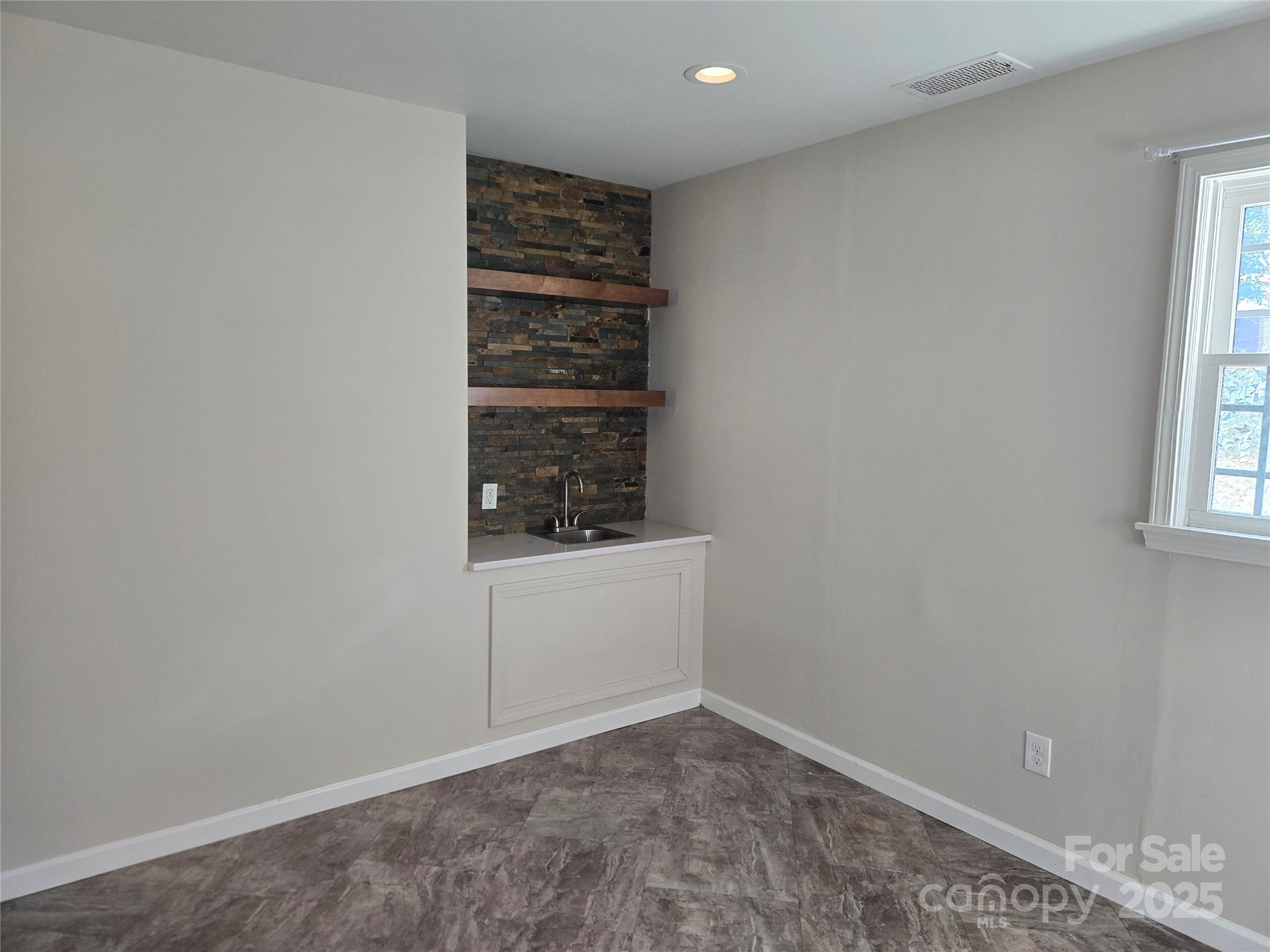 7214 Fox Hunt Road Charlotte, NC 28212 - Photo 21 of 24 a view of an empty room and window